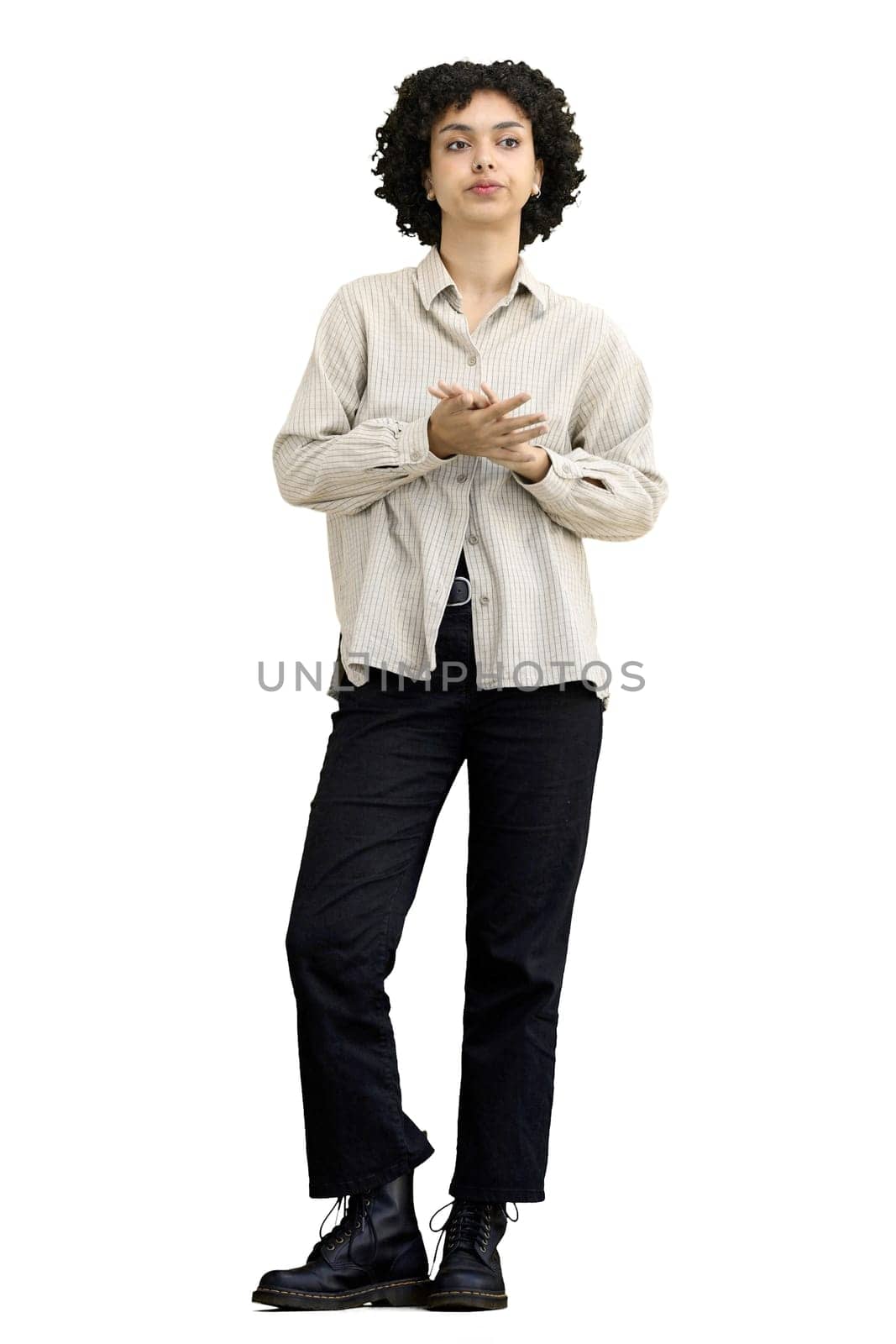 A woman, full-length, on a white background, looks at her watch by Prosto