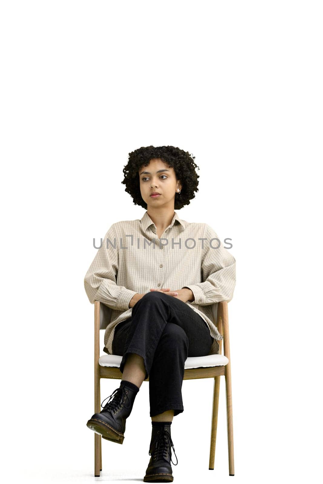 A woman, full-length, on a white background, sitting on a chair by Prosto
