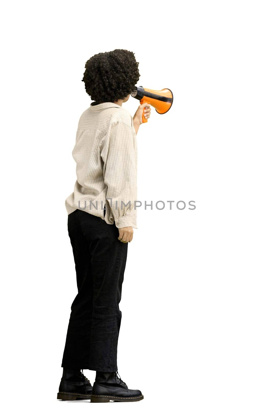 A woman, full-length, on a white background, with a megaphone.