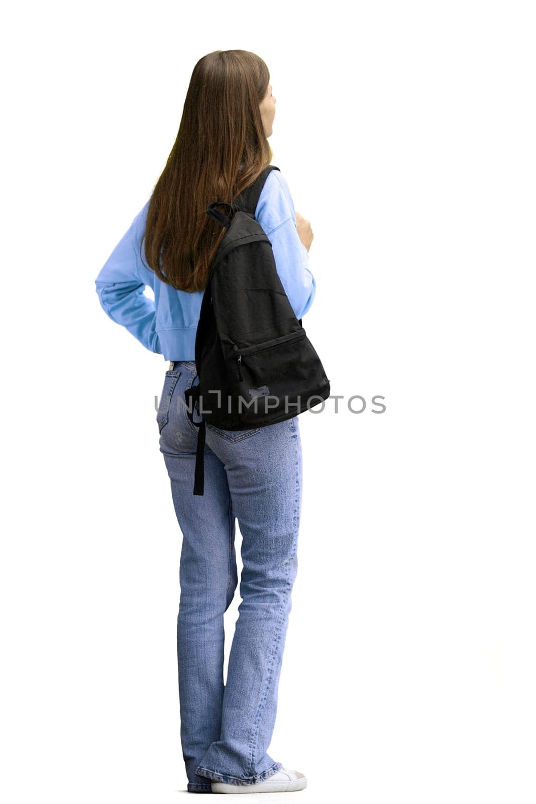 A woman, full-length, on a white background, with a backpack.