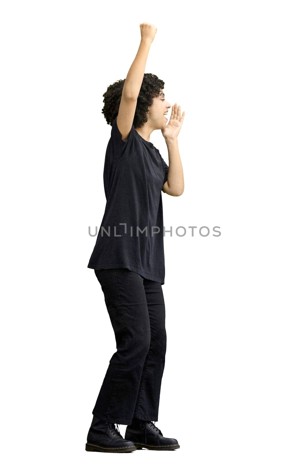 A woman, full-length, on a white background, rejoices.