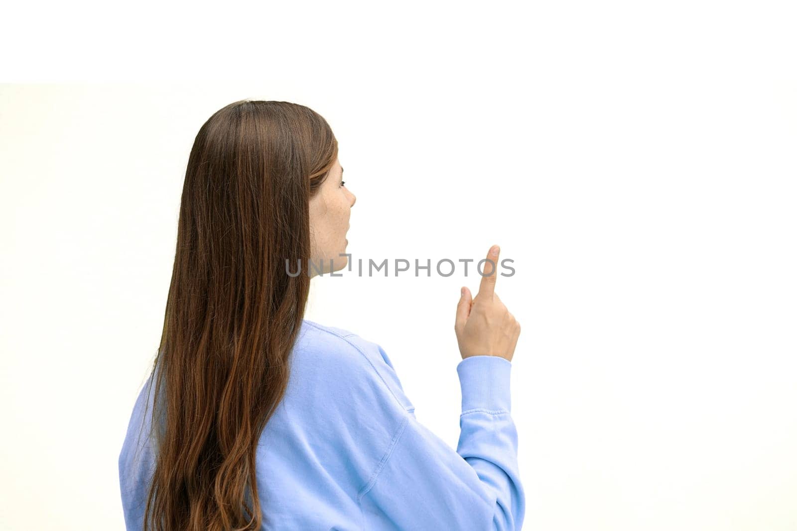 Woman, close-up, on a white background, pointing up by Prosto
