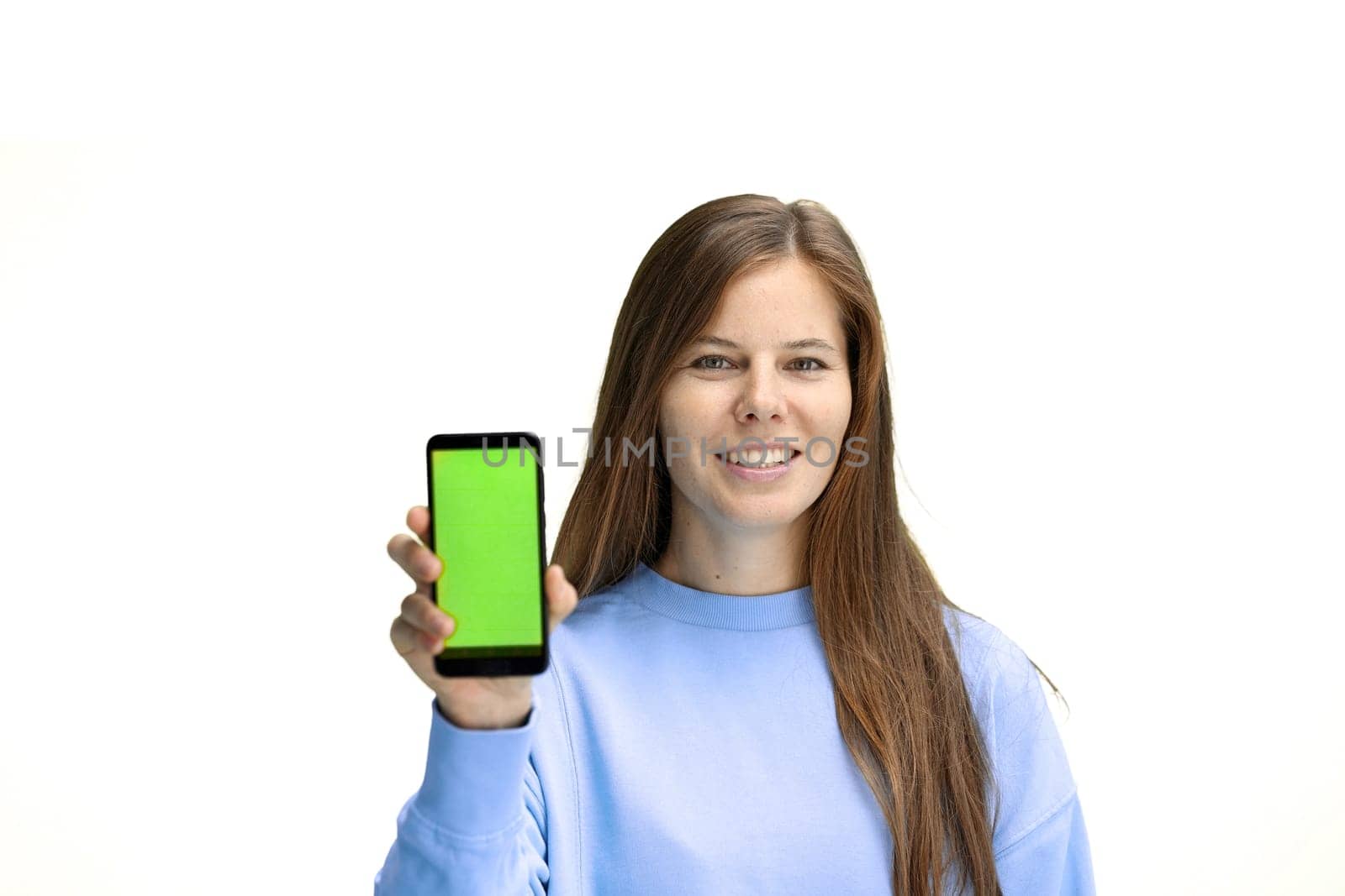 Woman, close-up, on a white background, with a phone.