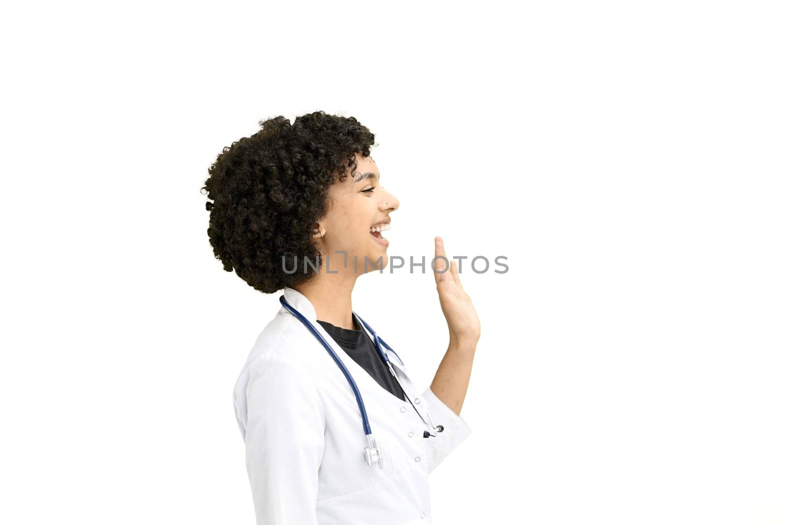 Female doctor, close-up, on a white background, waving her hand by Prosto