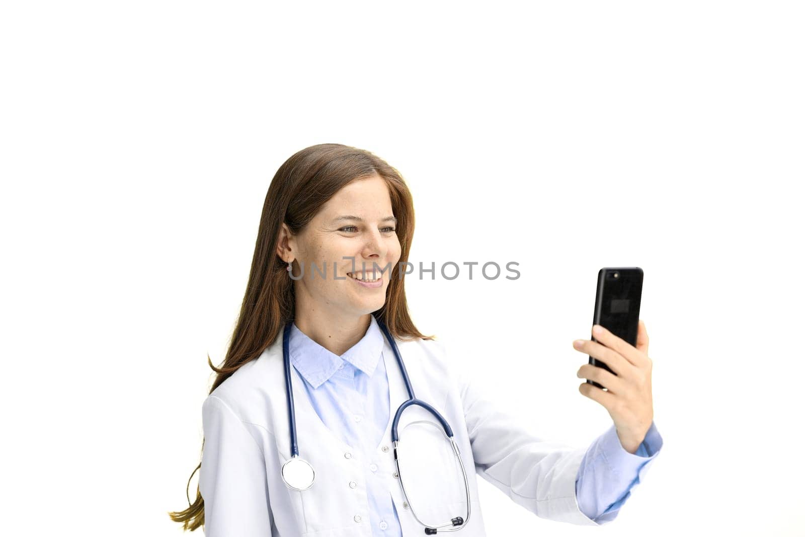 Female doctor, close-up, on a white background, with a phone.