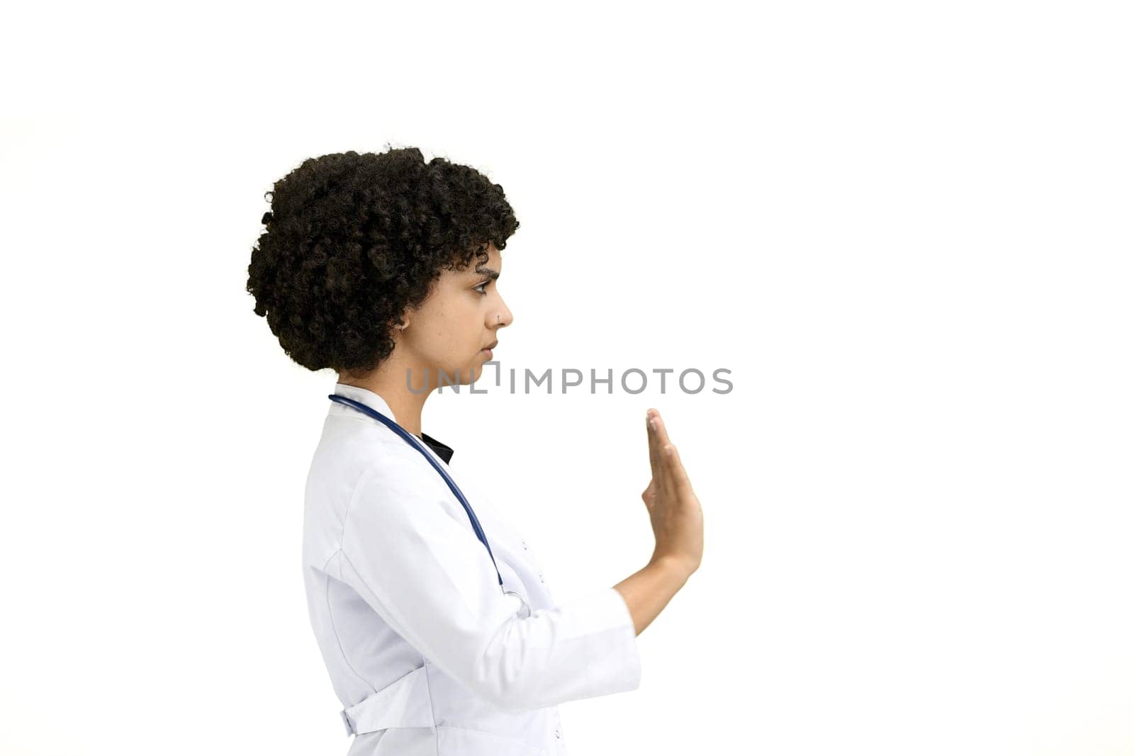 Female doctor, close-up, on a white background, shows a stop sign by Prosto