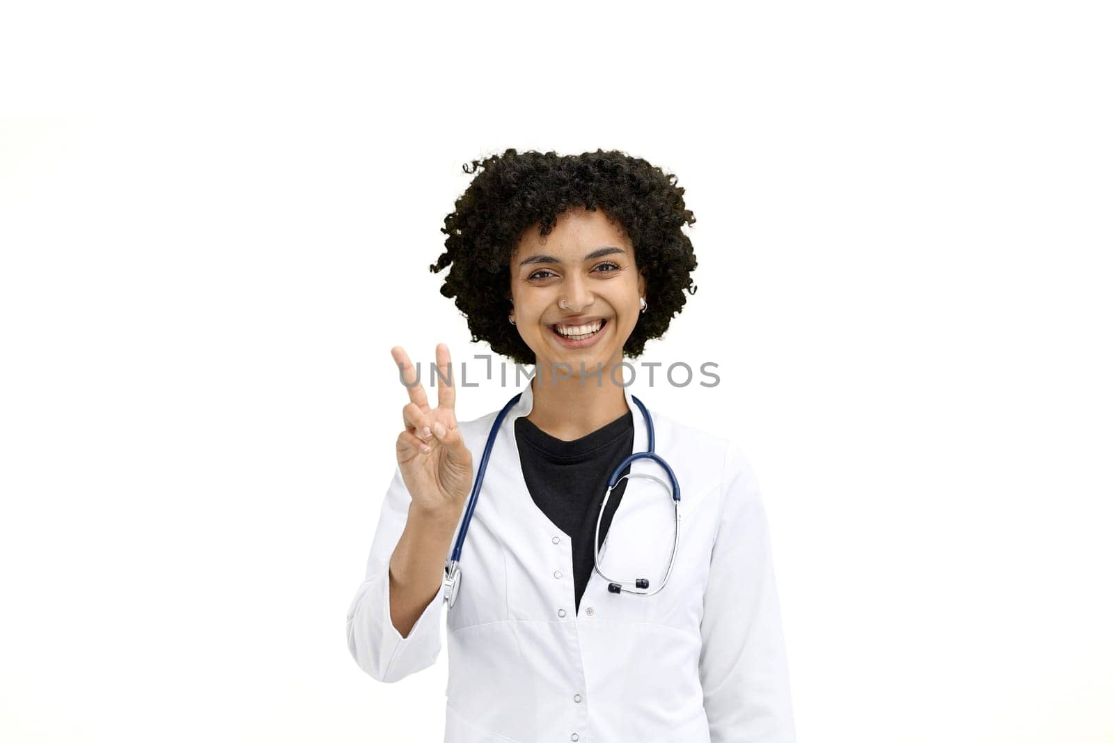 Female doctor, close-up, on a white background, shows a victory sign by Prosto
