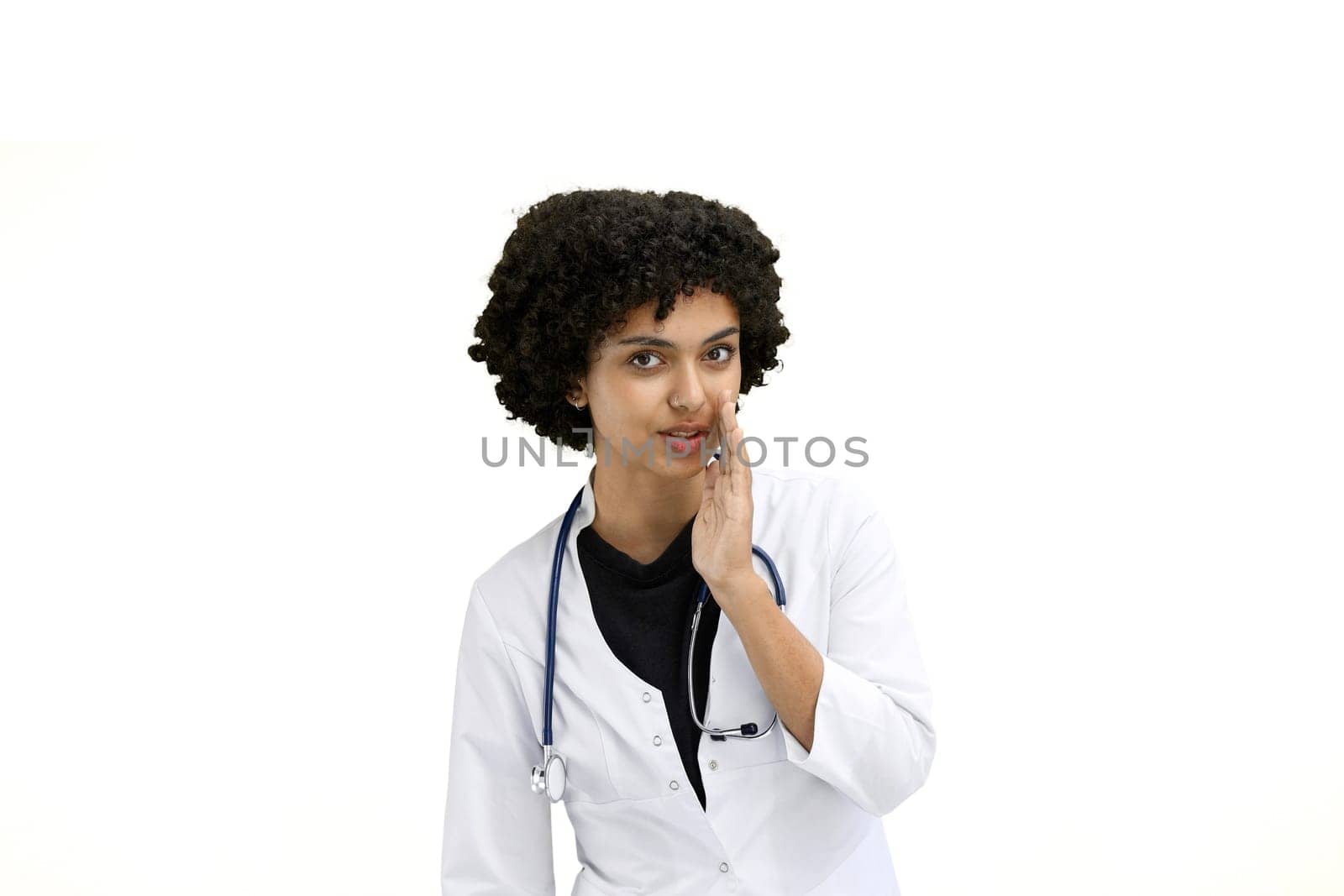 Female doctor, close-up, on a white background, tells a secret by Prosto