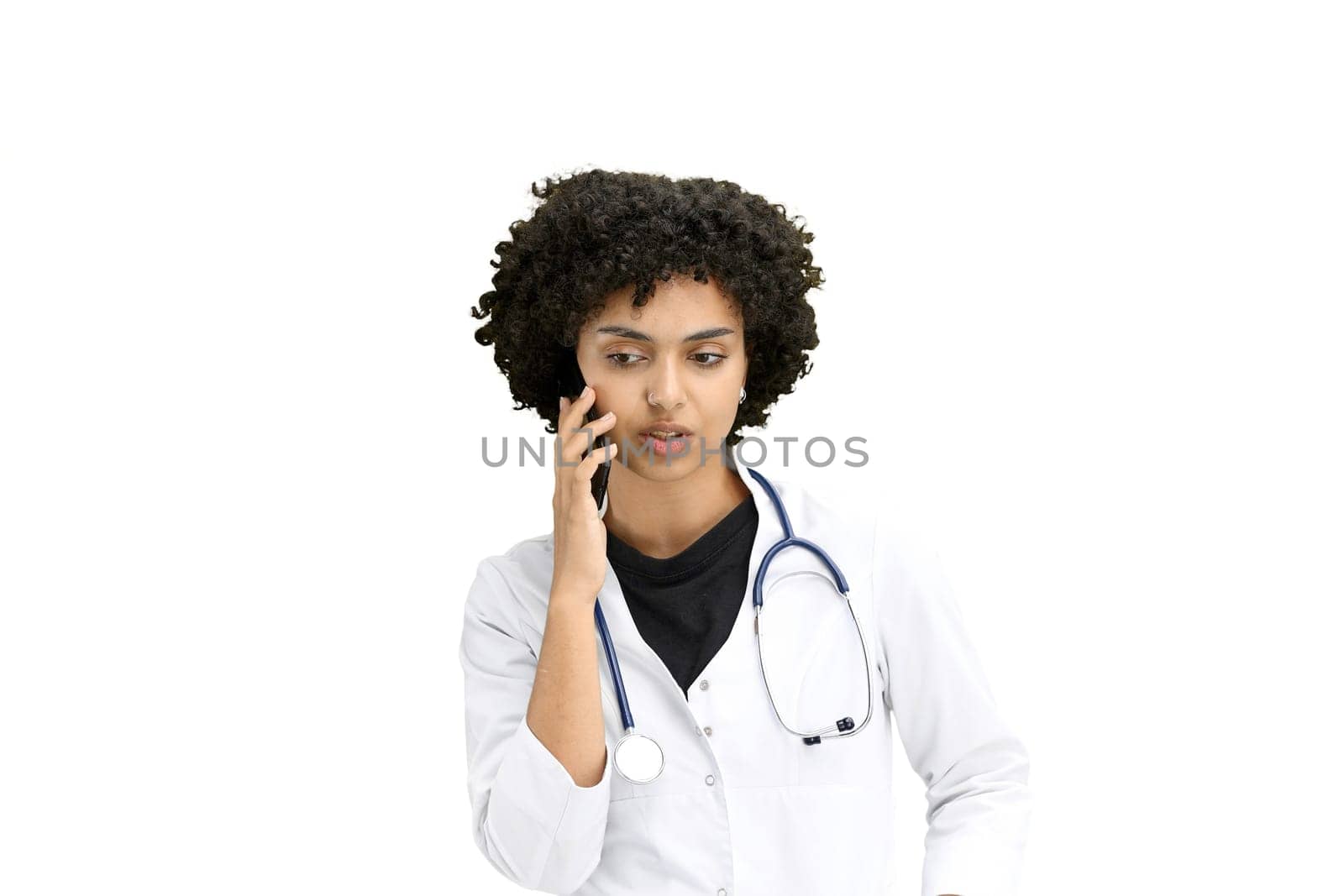 Female doctor, close-up, on a white background, with a phone.