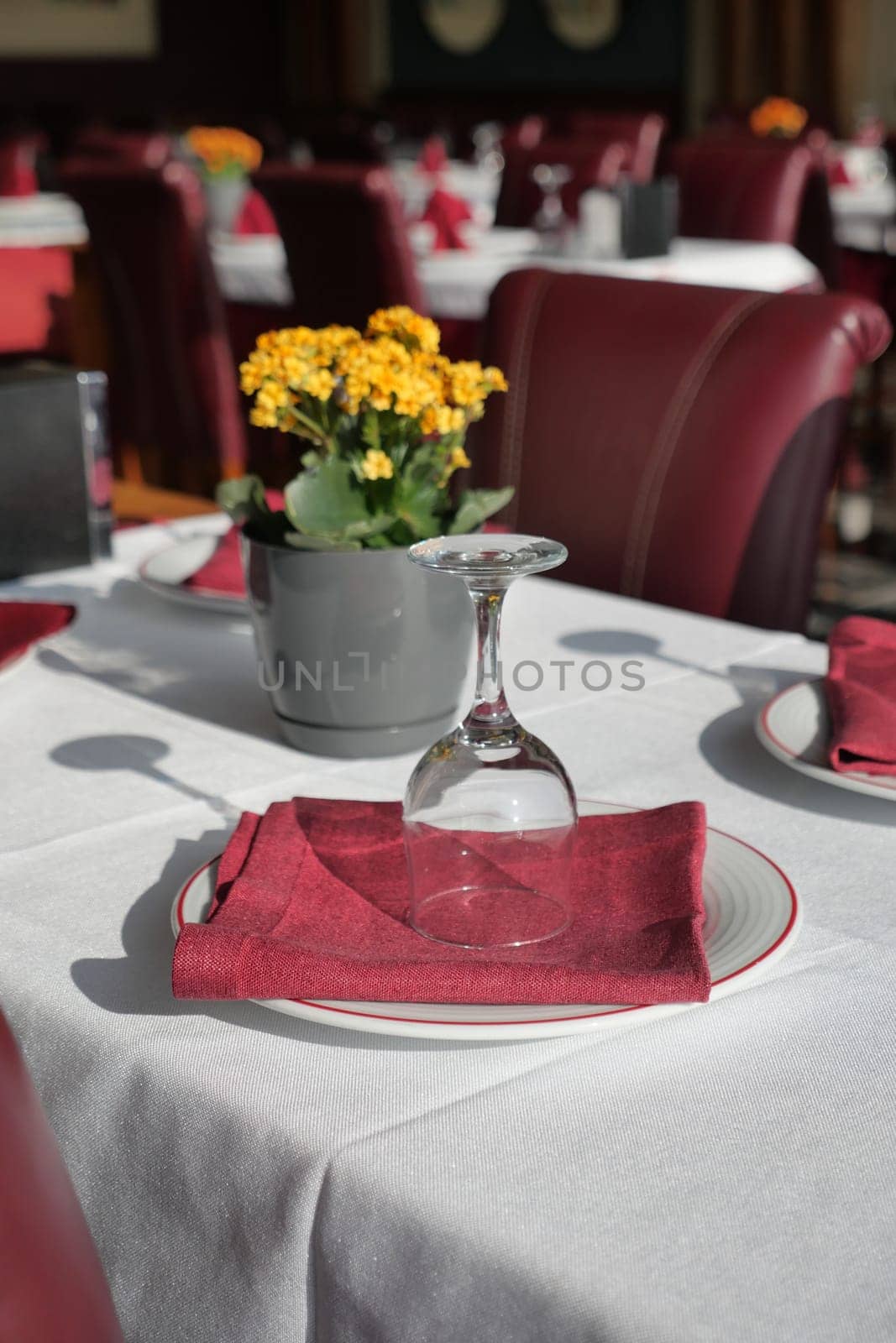 served and decorated round festive table in a restaurant .