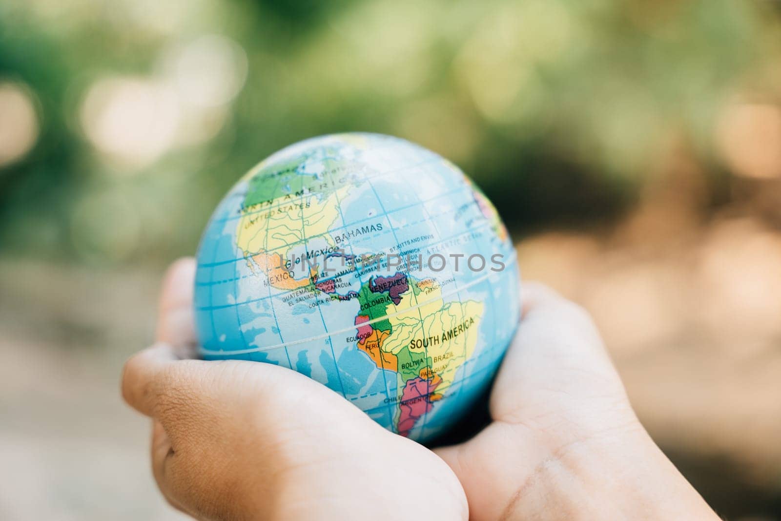 World Earth Day calls for holding the globe and a green leaf, symbolizing Green Energy, ESG, and Environmental Responsibility. Support our planet's vitality and environmental care. by Sorapop