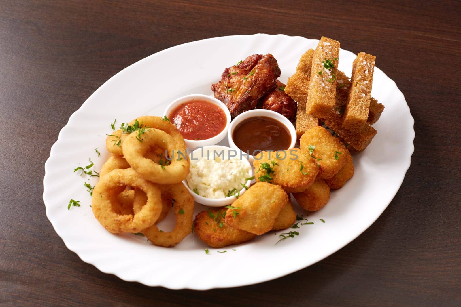 Fast food. Image of dish with snacks and sauces, close-up