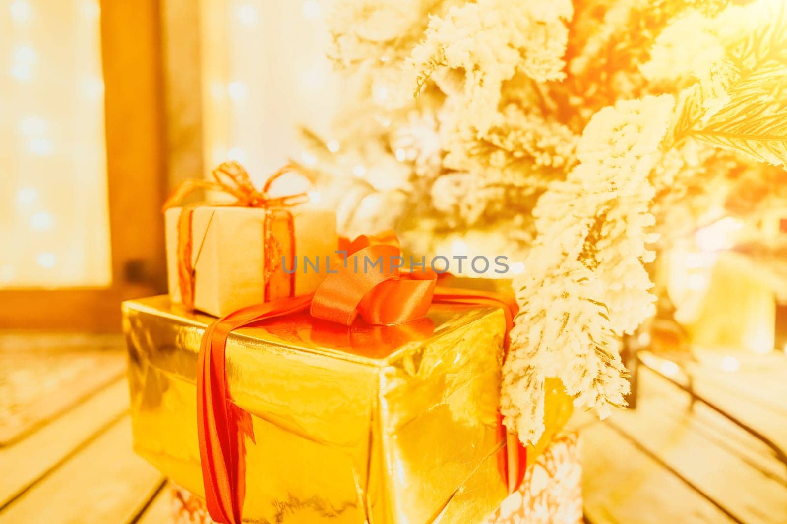 presents under Christmas tree, festive and celebratory atmosphere. by panophotograph