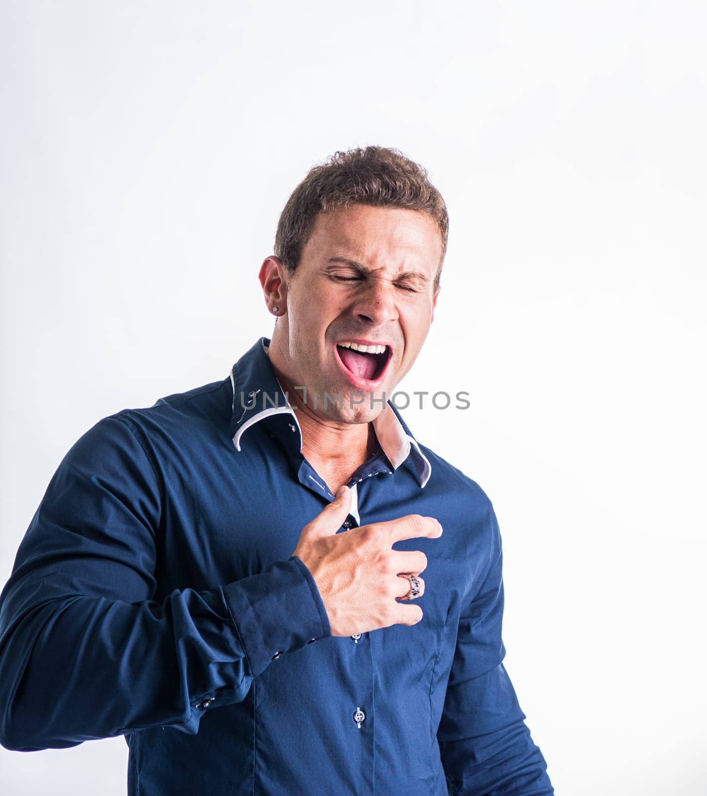 Man making funny face with hands by artofphoto