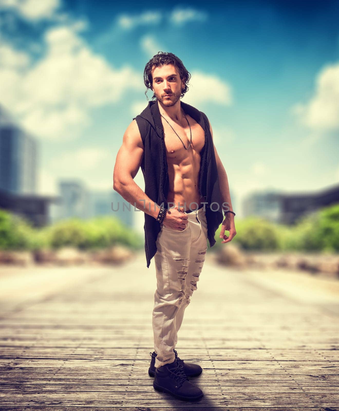 Shirtless man standing on brick road by artofphoto