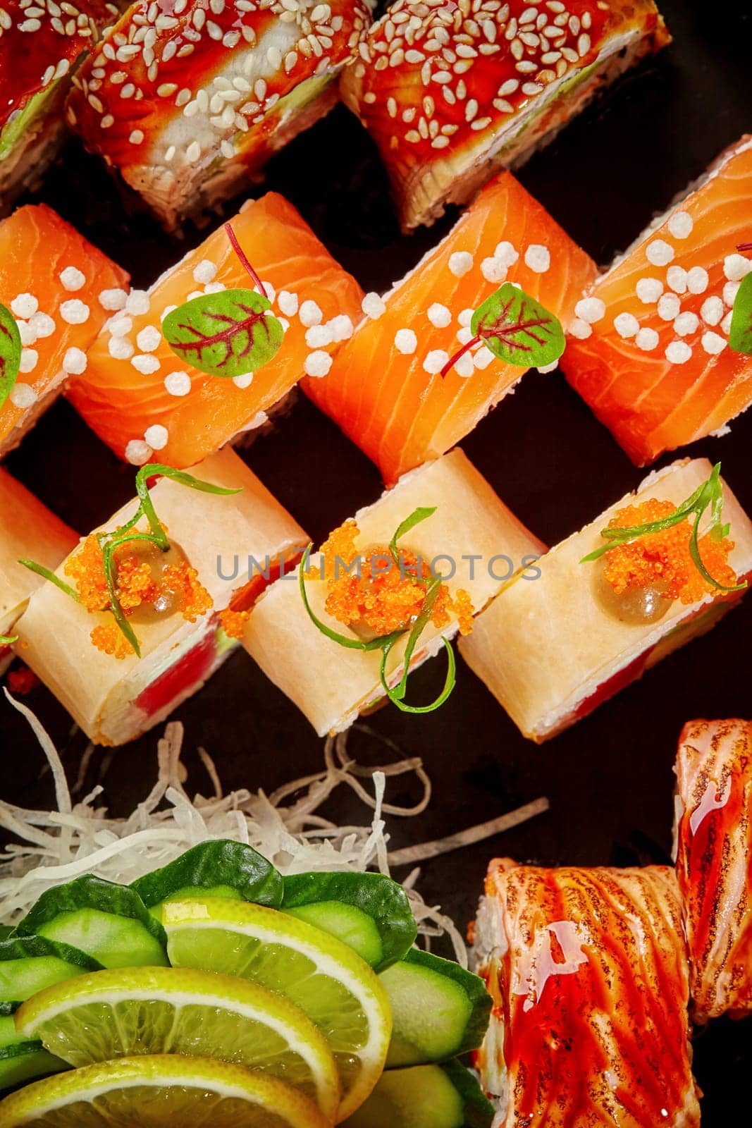 Vibrant assorted sushi rolls with salmon, eel, tuna, mamenori by nazarovsergey