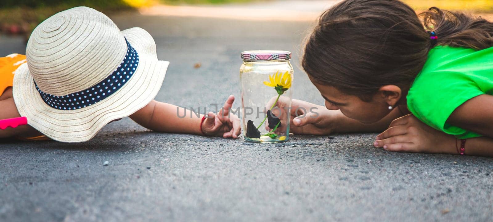 A child catches a butterfly in nature. selective focus. by yanadjana