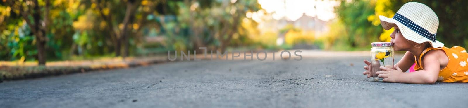 A child catches a butterfly in nature. selective focus. kid.