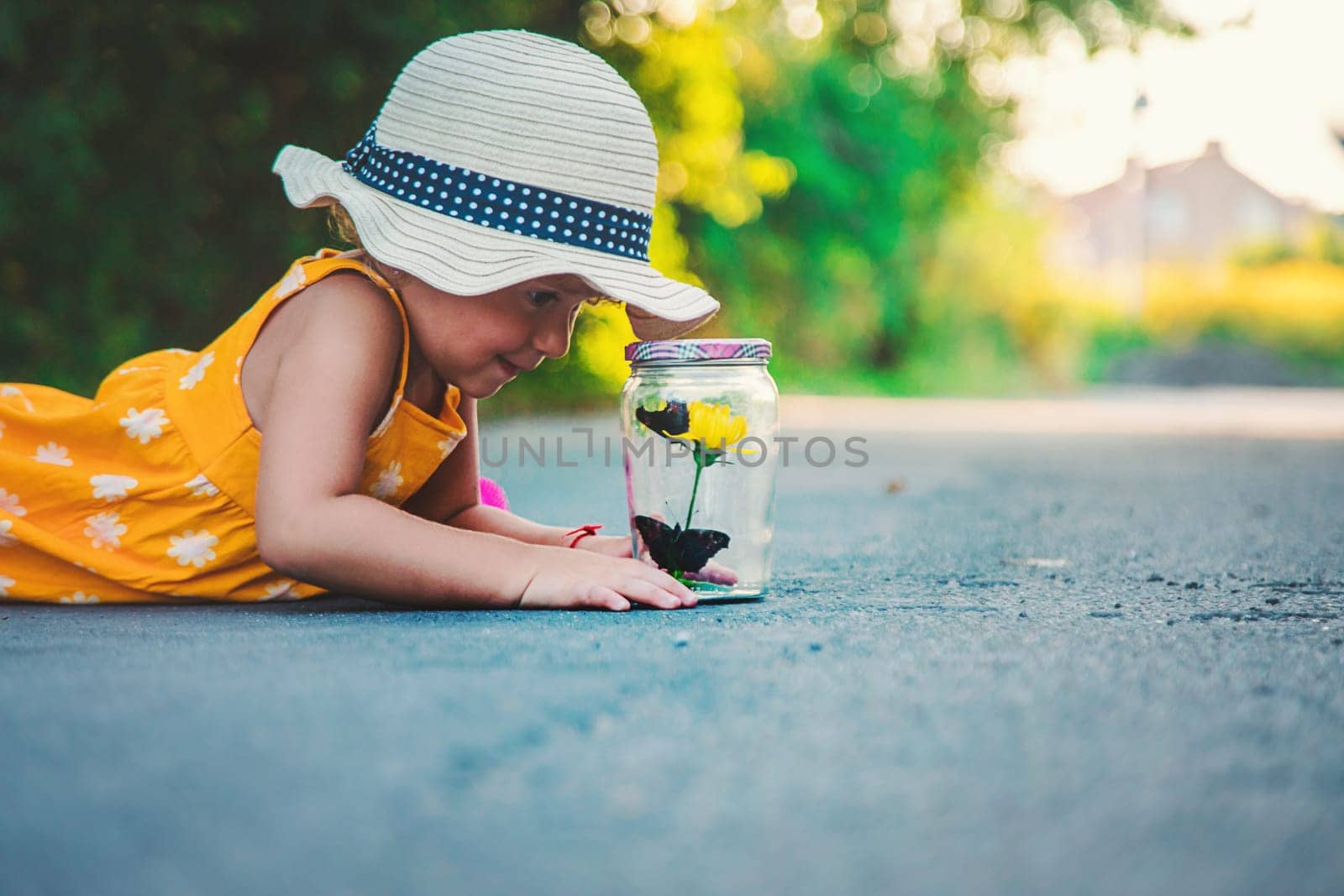 A child catches a butterfly in nature. selective focus. kid.