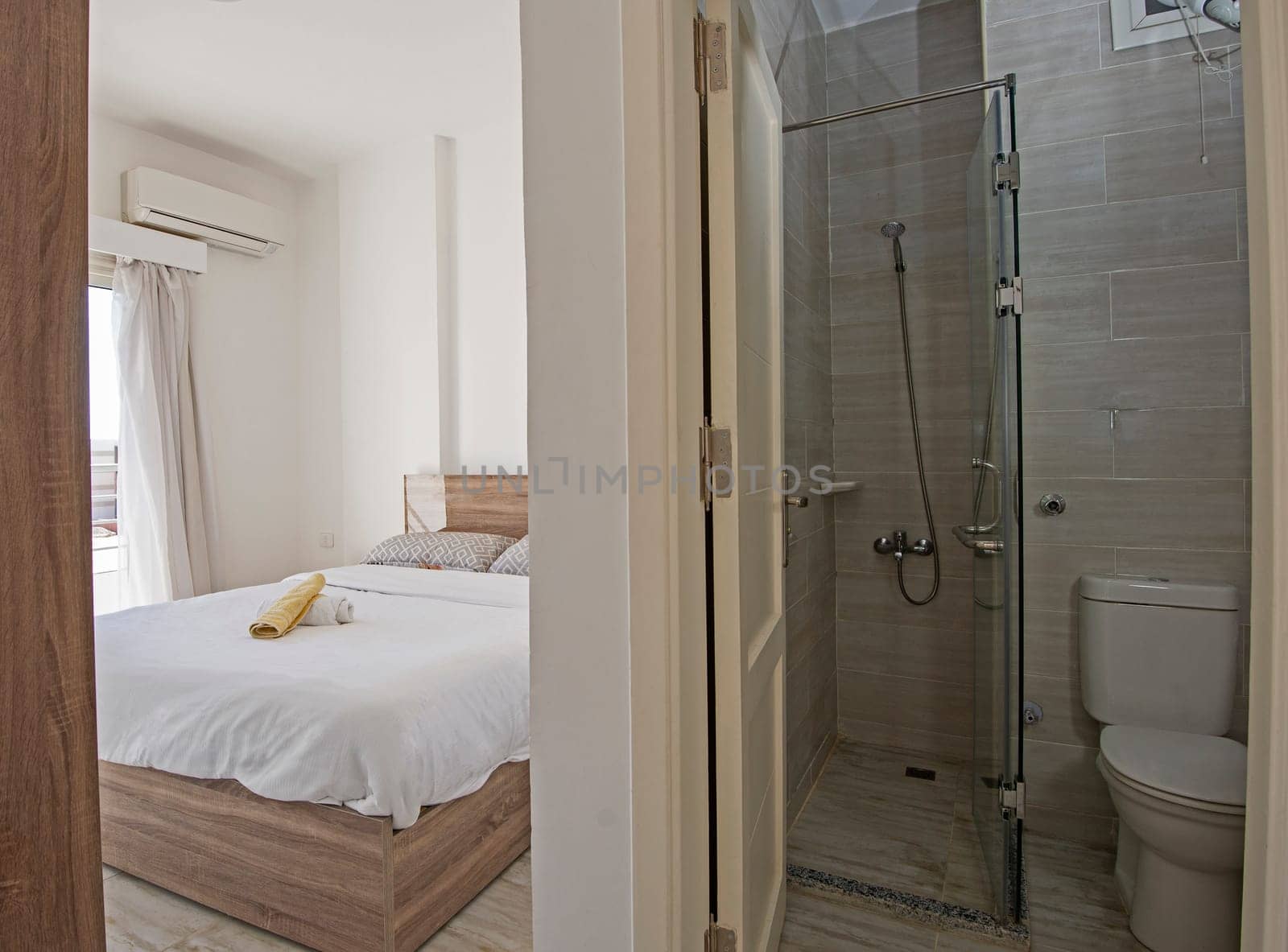 Interior design of modern en suite bedroom in apartment by paulvinten