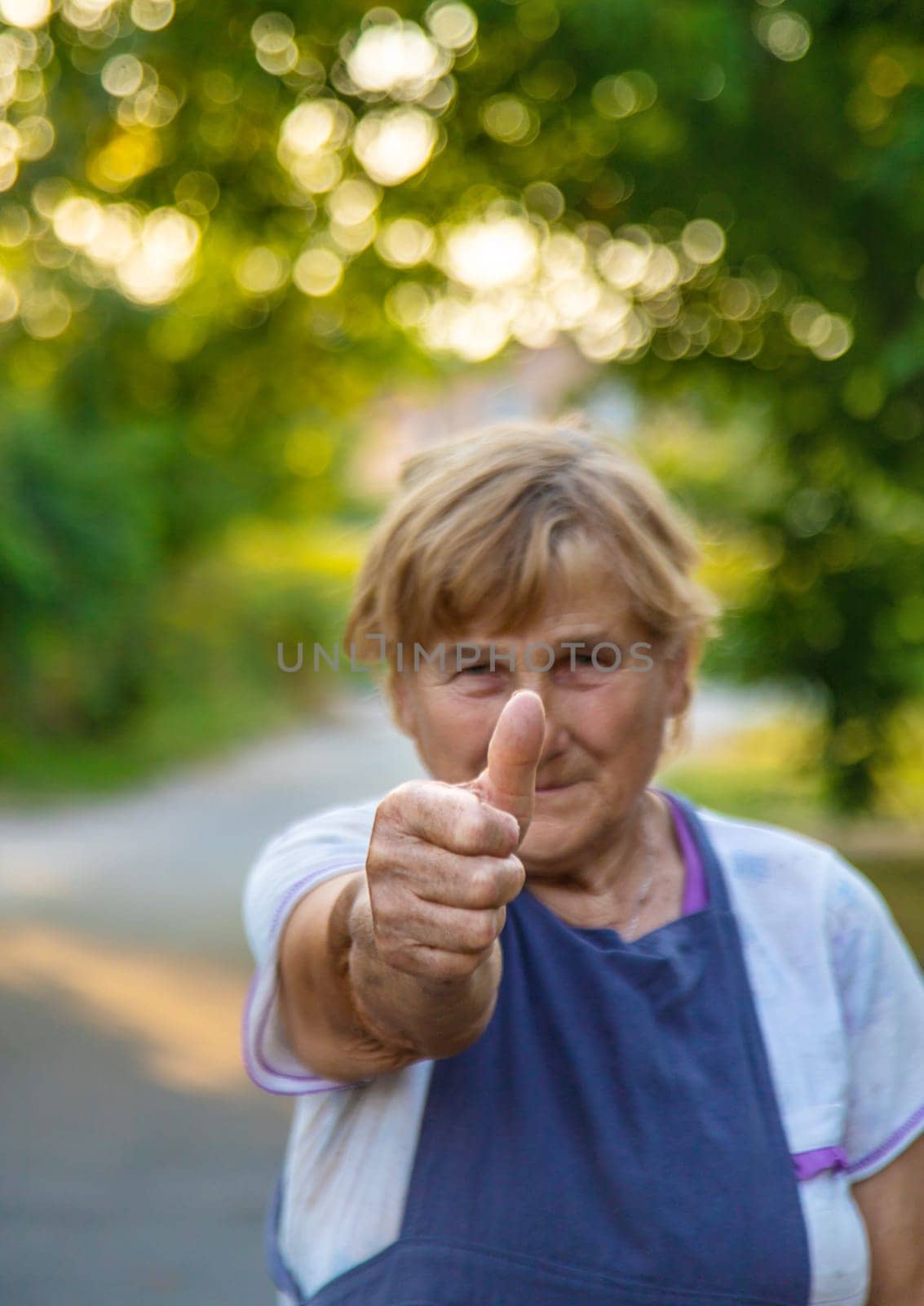 Elderly woman portrait in the garden. selective focus. Nature.