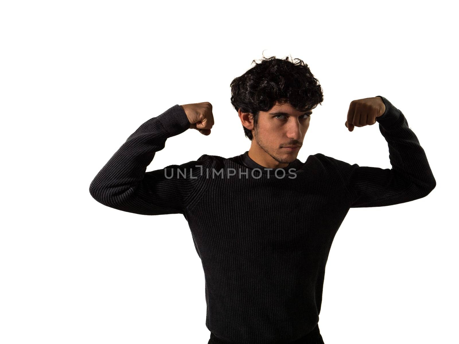 Muscular man in black sweater flexing by artofphoto