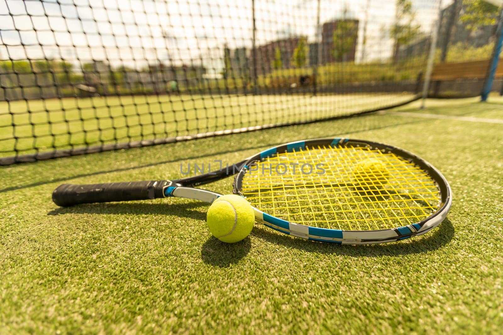 tennis racket with a tennis ball on a tennis court by Andelov13