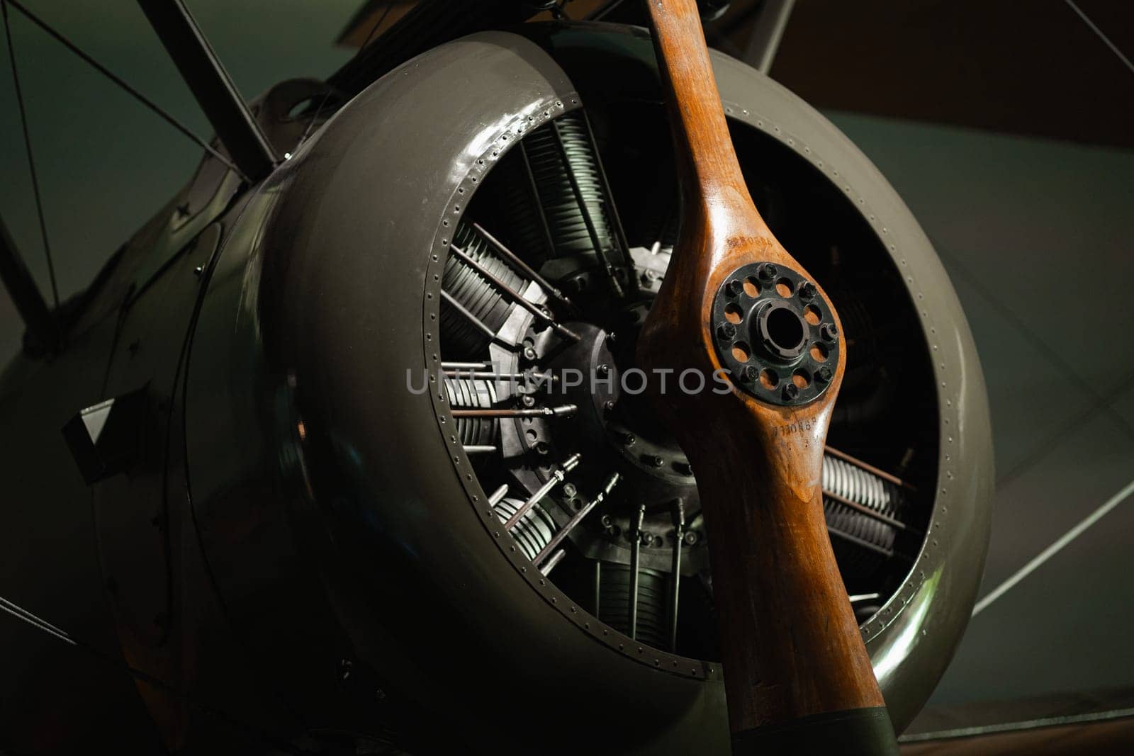 Old airplane engine with propeller, closeup front view of retro classic aircraft with details