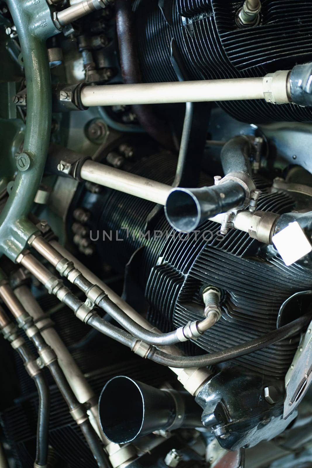 Old airplane engine, closeup metal pipes and details of small gasoline plane