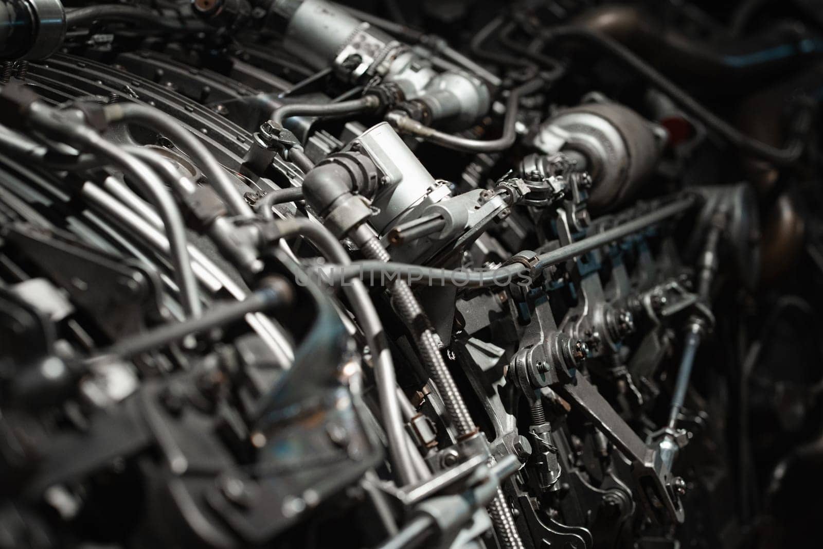 Old propeller aircraft inside, closeup of small metal vintage classic engine details