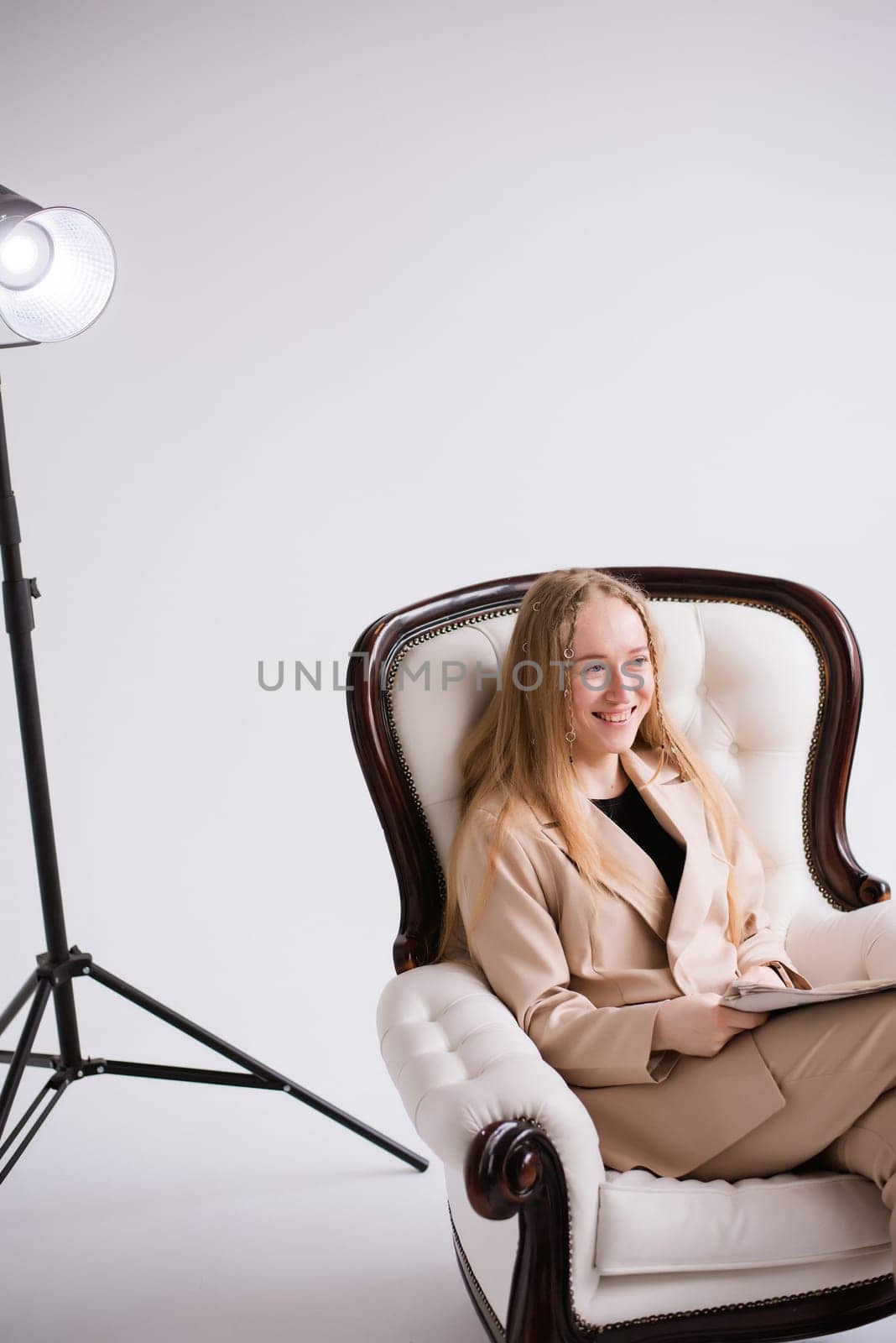 Woman blonde blogger in white photo studio by OksanaFedorchuk