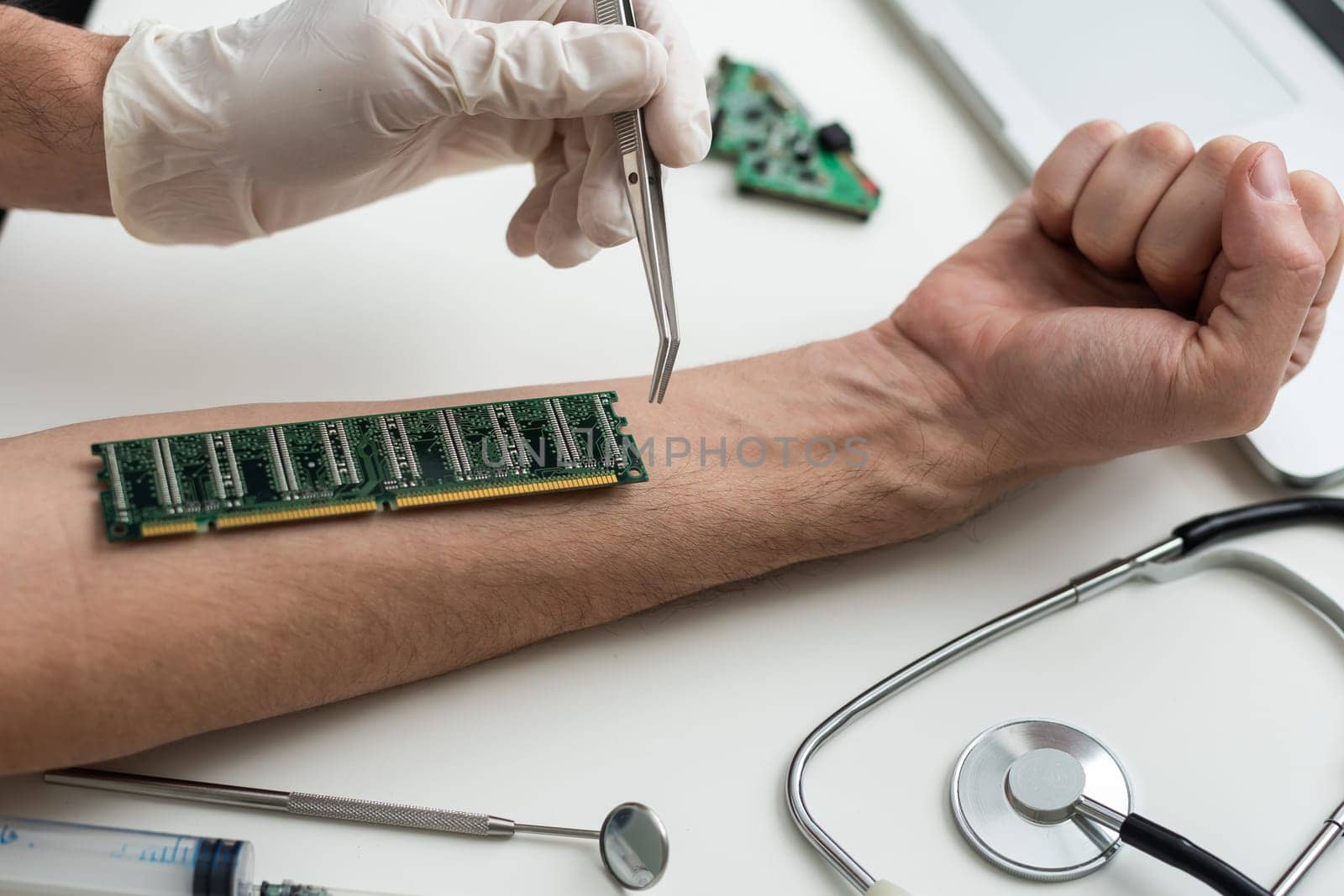 cropped view of male hand with microchip and syringe for microchipping on table. High quality photo