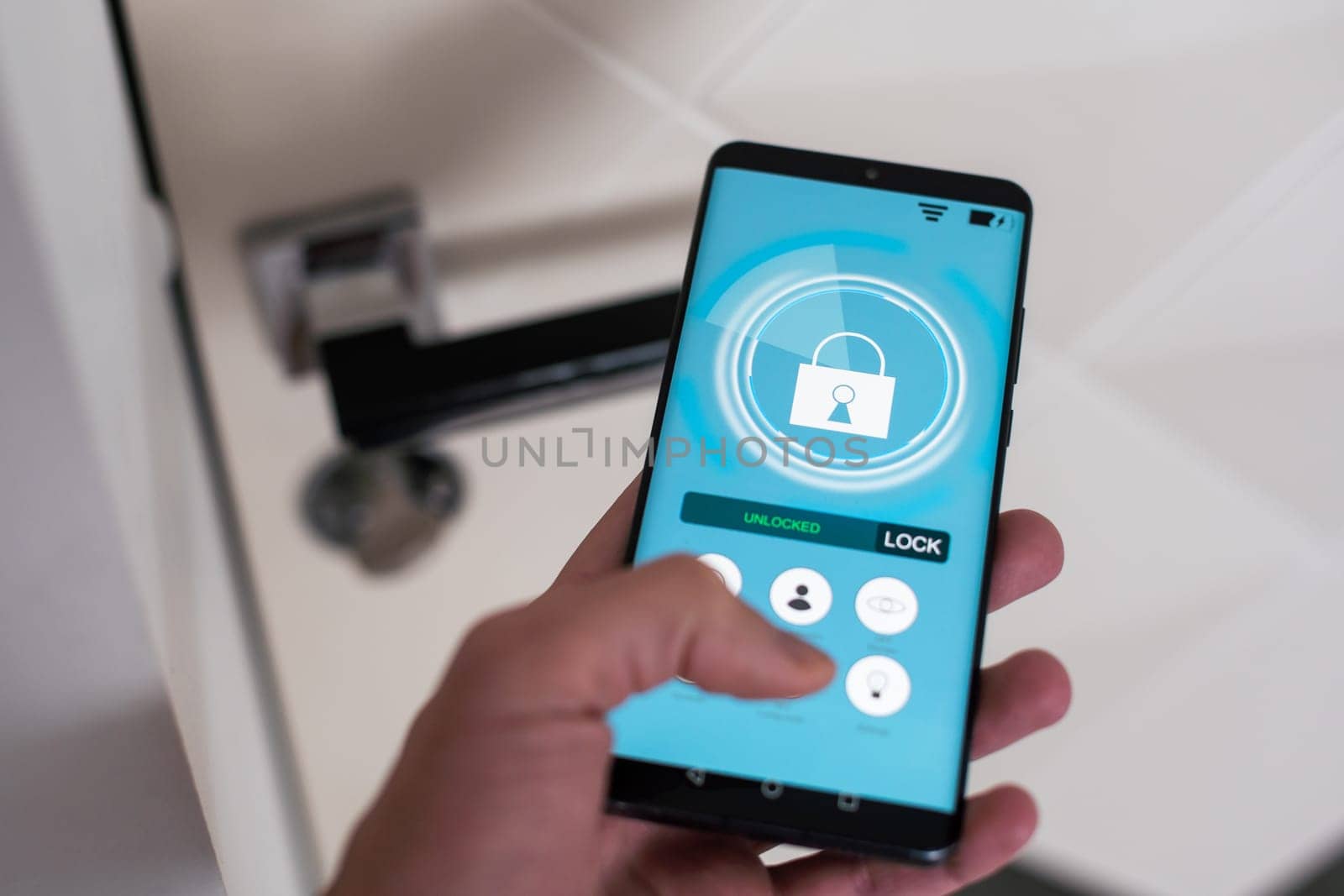 Locking door using mobile application. High quality photo
