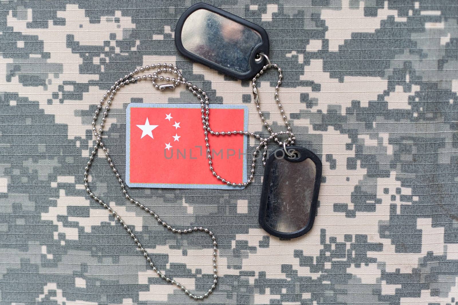 army blank, dog tag with flag china on the khaki texture background. military concept. High quality photo