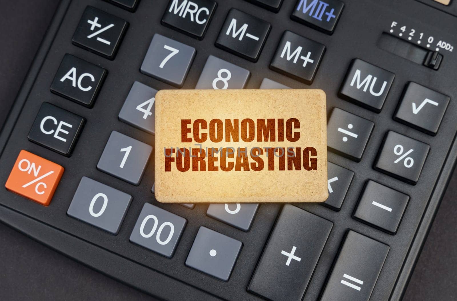 There is a sign on the calculator that says - Economic forecasting by Sd28DimoN_1976