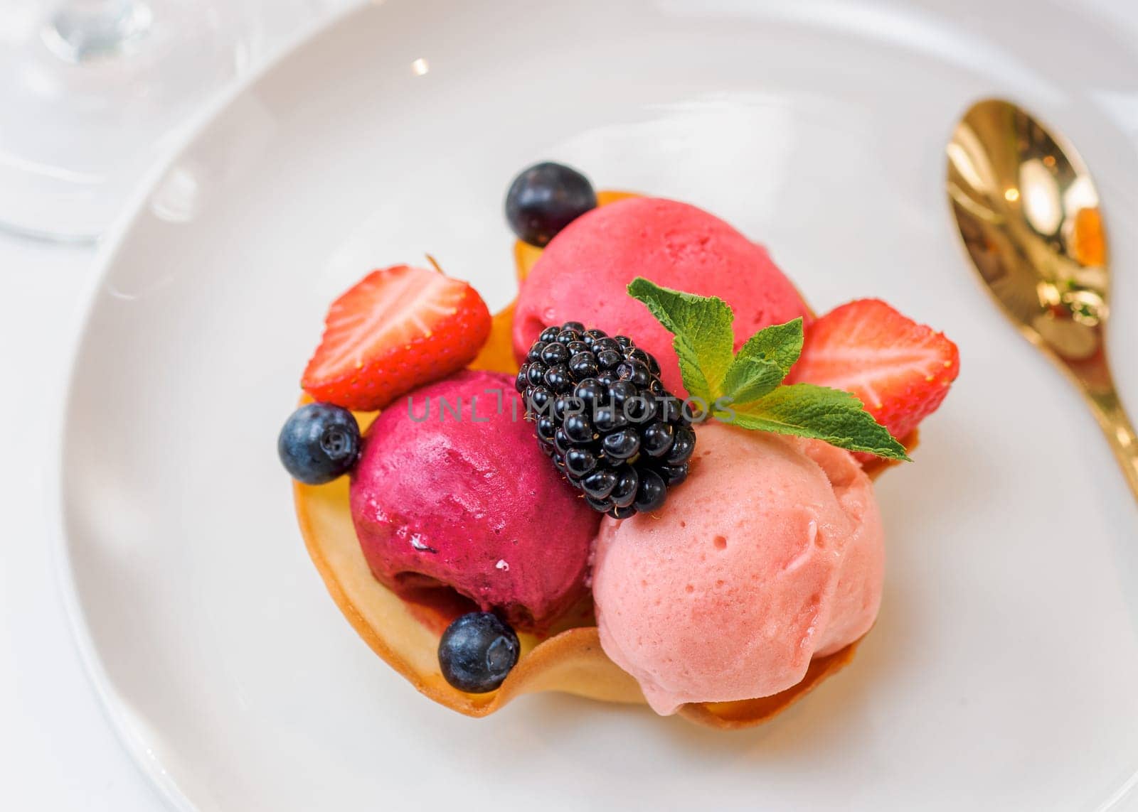 Berry sorbet portion on the table by fascinadora