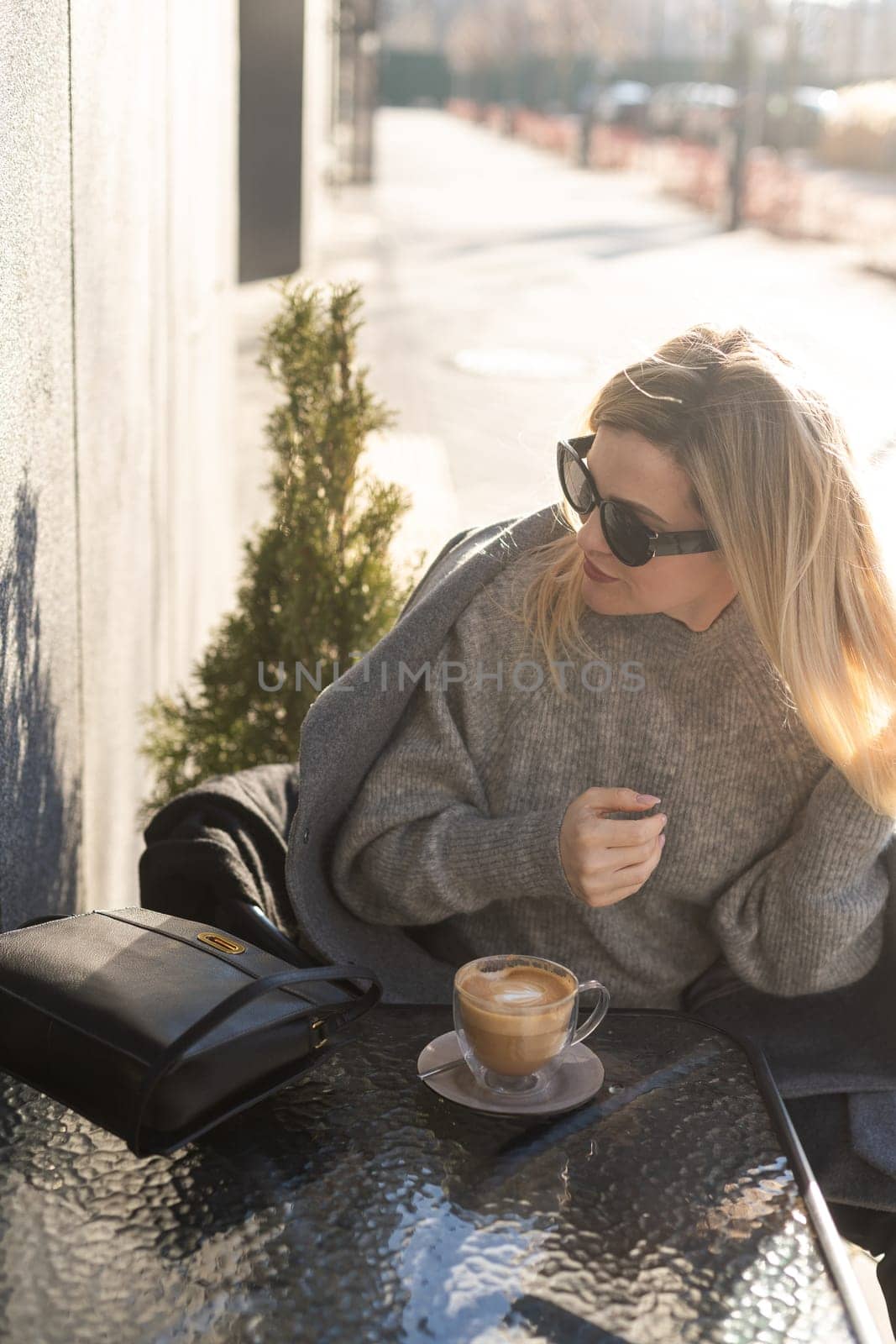 business woman on city open air cafe background. High quality photo