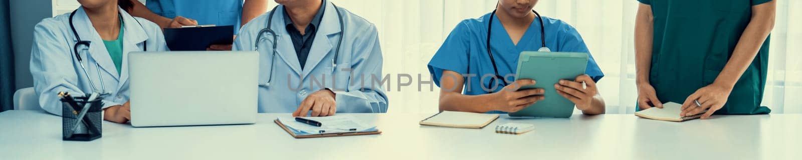 Professional various team of medical working together on the desk. Rigid by biancoblue