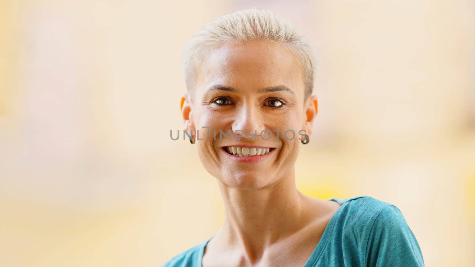 Modern and stylish woman smiling at camera by ivanmoreno