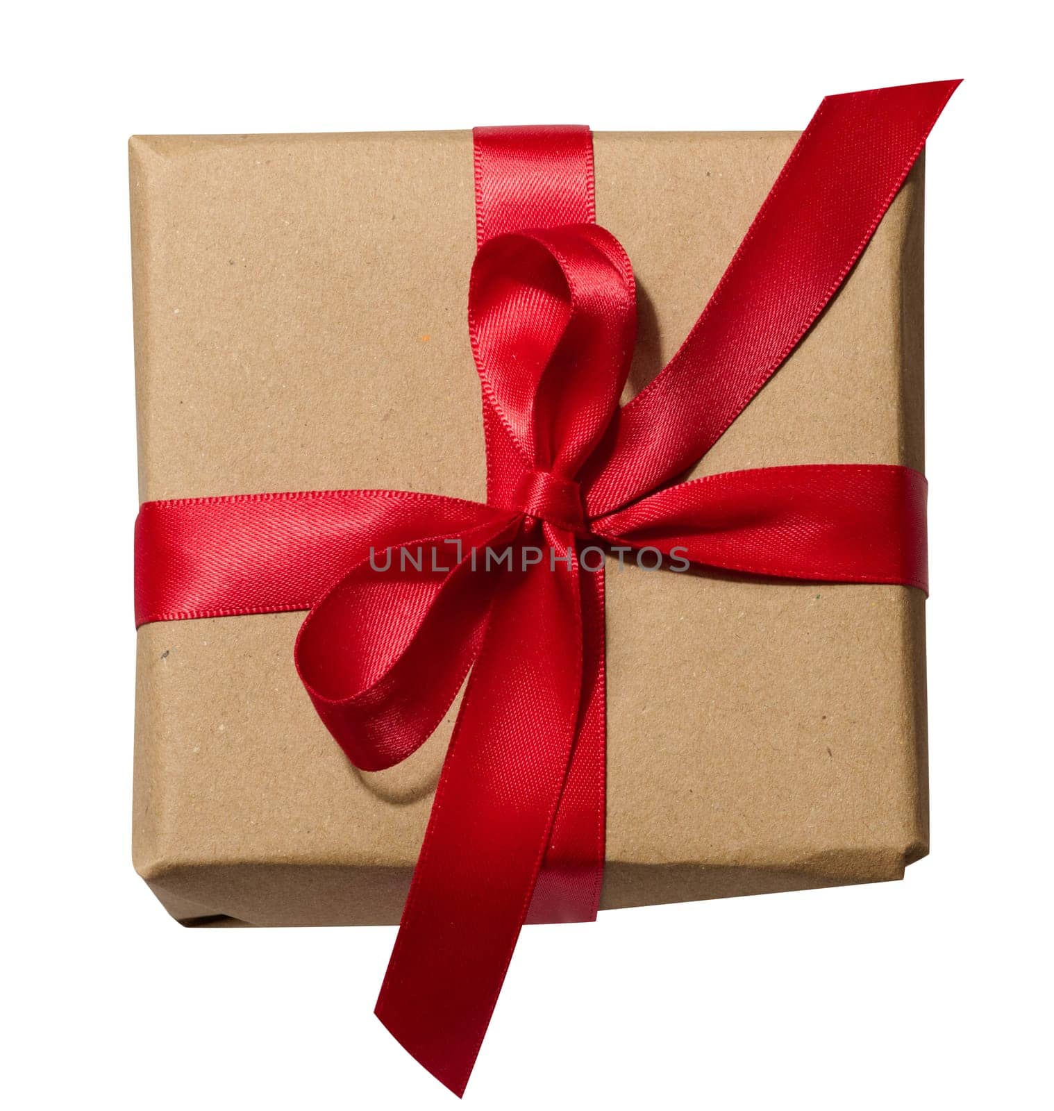 Box is wrapped in brown paper and red ribbon on a white isolated background by ndanko