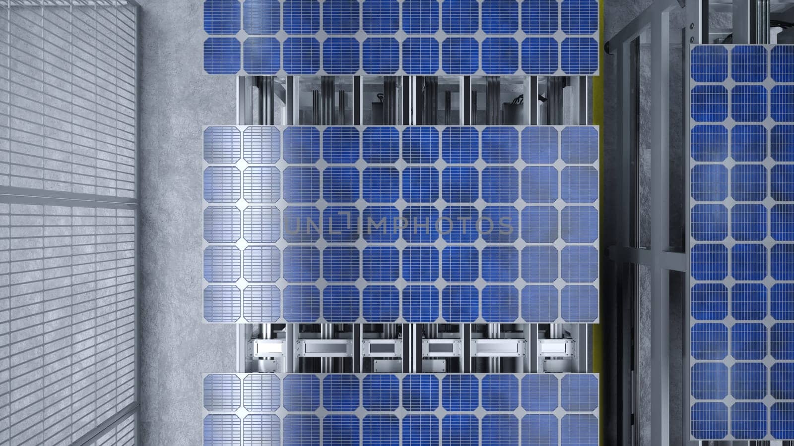 Top view of solar panel assembly line operated by high tech robot arms in modern sustainable factory. Aerial shot of photovoltaics production process taking place in automated facility