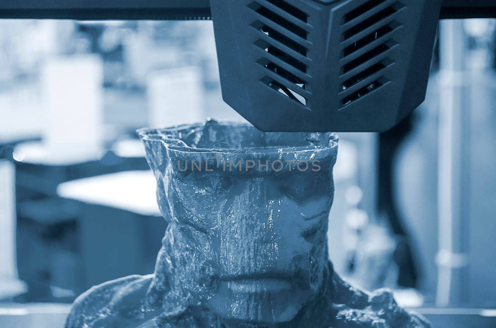 The process of printing an object with 3D printer. 3D printer printing a model from molten plastic. 3D printing. Robotic creation of mold form. Automated creation prototyping of 3D printers technology