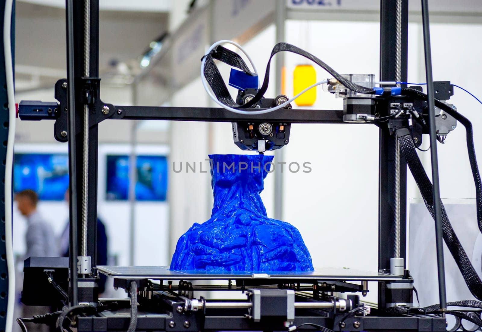 The process of printing an object with 3D printer. 3D printer printing a model from molten plastic. 3D printing. Robotic creation of mold form. Automated creation prototyping of 3D printers technology