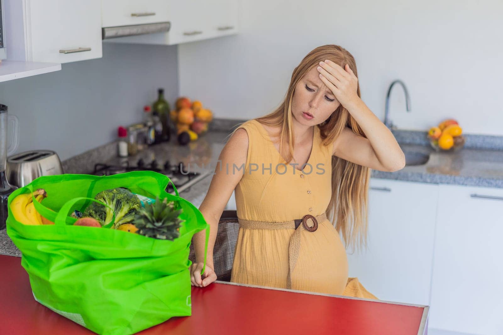 Exhausted but resilient, a pregnant woman feels fatigue after bringing home a sizable bag of groceries, showcasing her dedication to providing nourishing meals for herself and her baby.