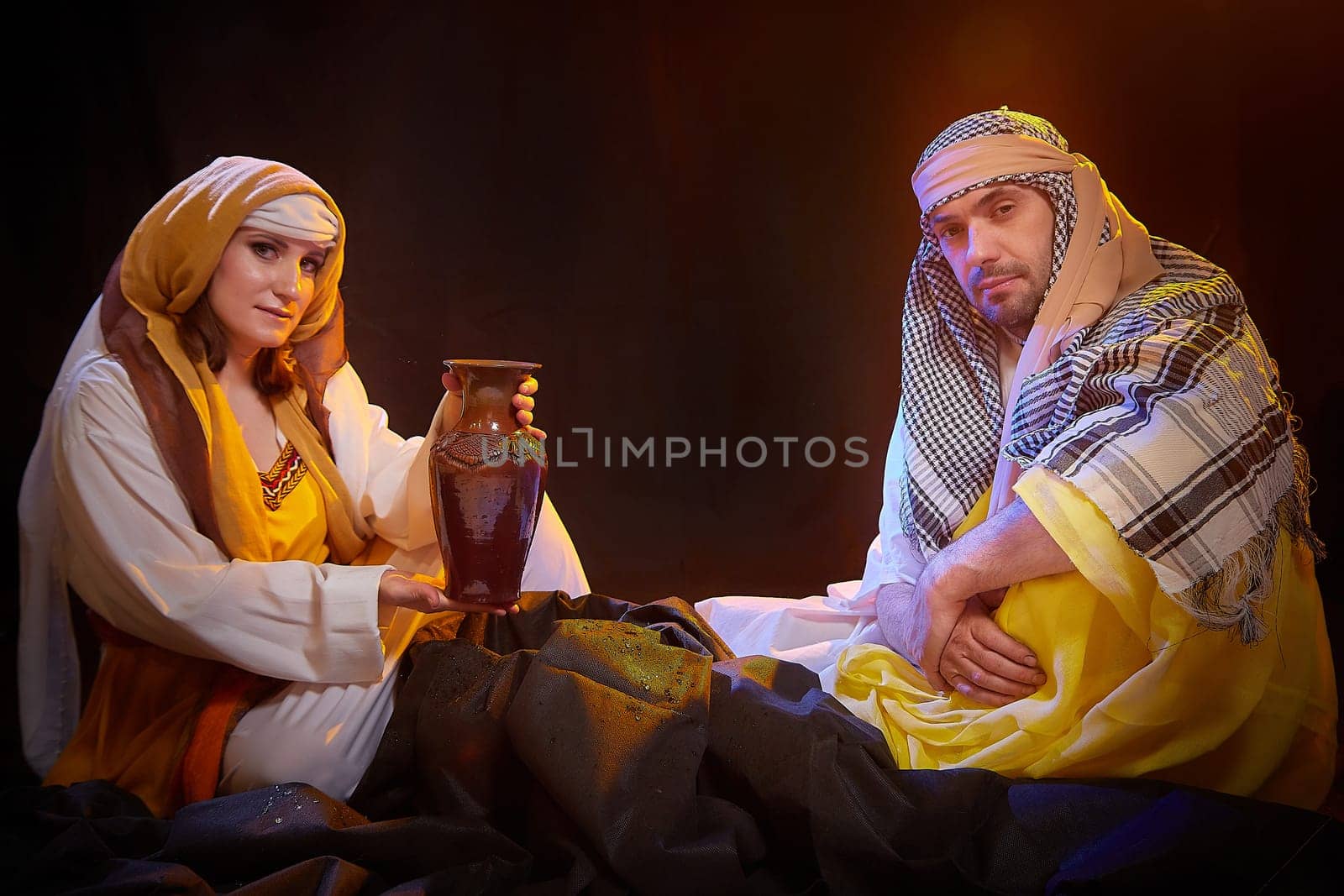 A couple in love or a married couple in stylized Eastern clothing from Israel, Palestine, Iran, Pakistan together. Tender photo session in the style of the Middle East and the Bible