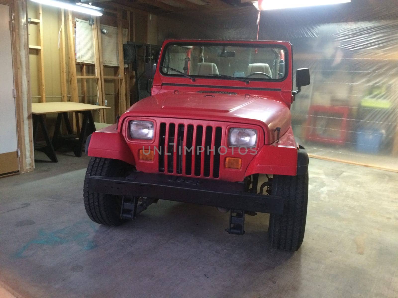 Auto Body Repair and Repainting Prep Work on Red Vehicle. High quality photo