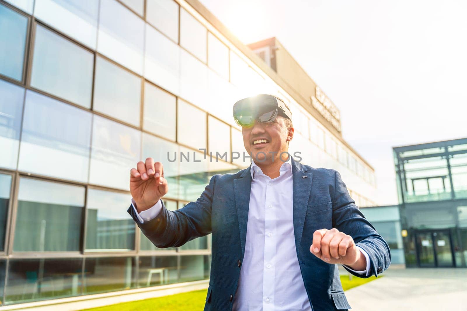 Businessman using virtual reality headset outside the offices by Huizi
