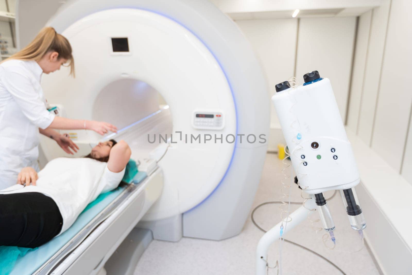 Medical CT or MRI Scan in the modern hospital laboratory. Interior of radiography department. Technologically advanced equipment in white room. Magnetic resonance diagnostics machine by Andelov13