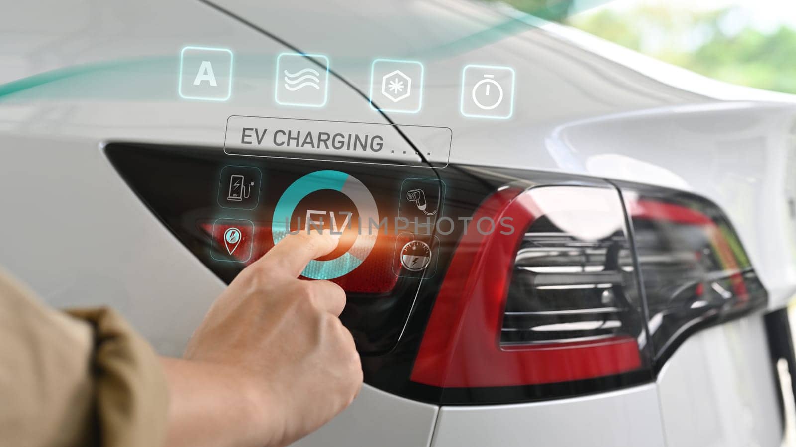 Cropped unrecognizable person hand opening a socket cap to preparing to charge an electric car.