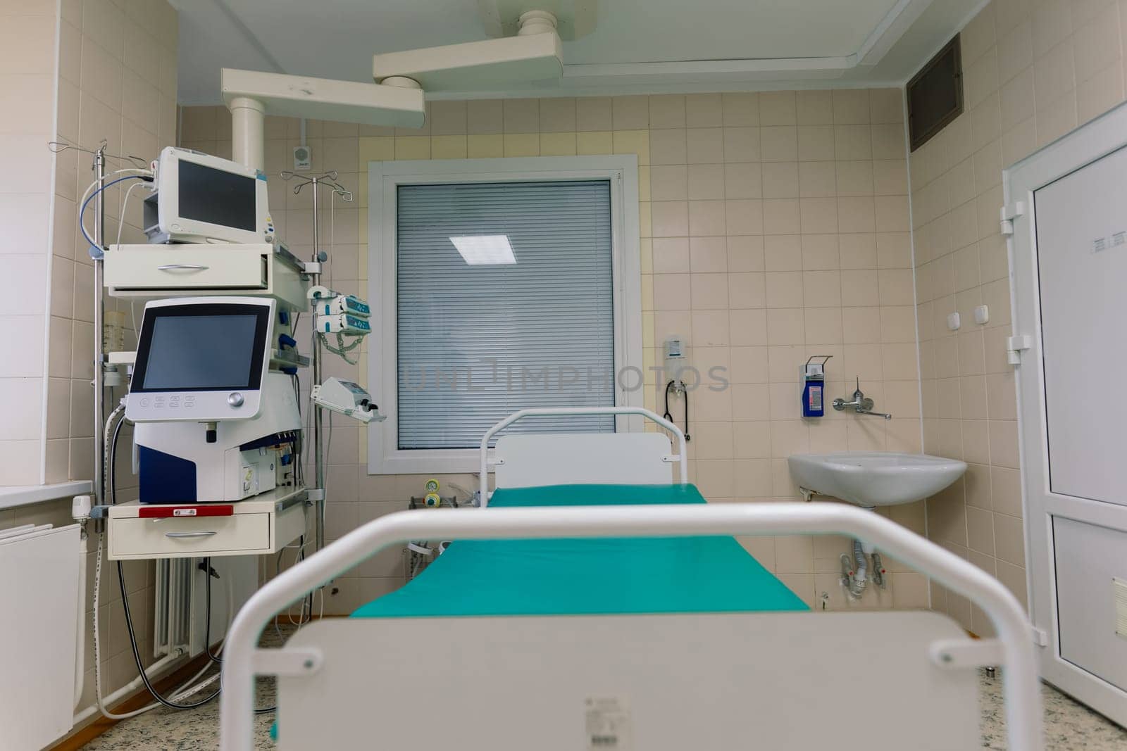 Interior of new operating room with equipment in modern clinic by Zelenin